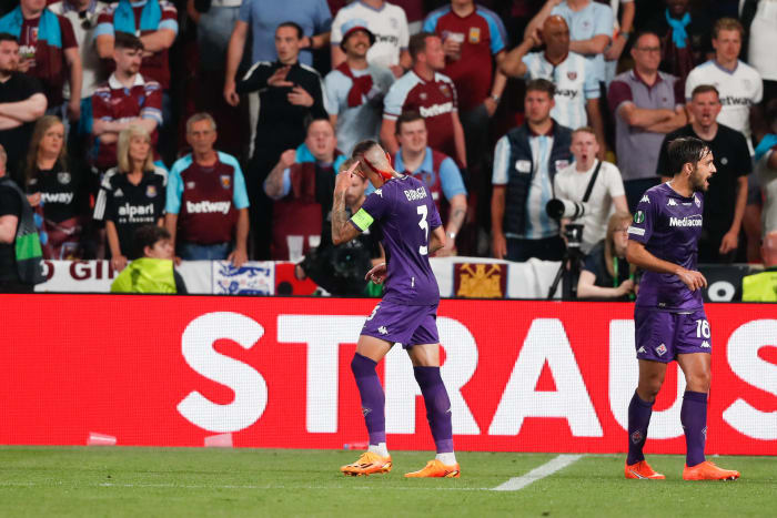 Fiorentina captain Cristiano Biraghi pictured with blood flowing from a cut on his head after being struck by an object thrown by West Ham fans during the 2023 UEFA Europa Conference League final